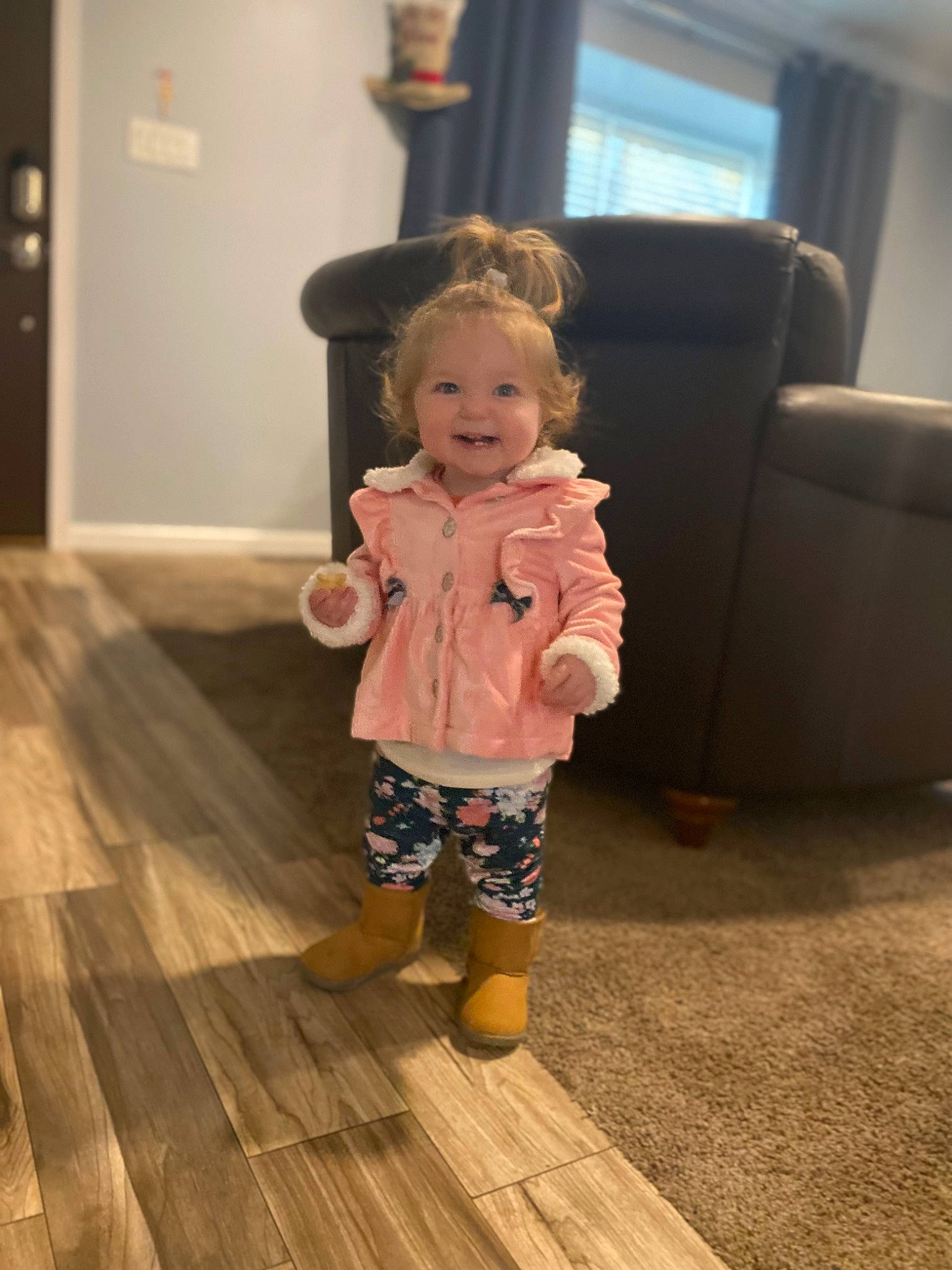 Olivia is registered to the contest to win money with this photo: baby, baby_toddler_clothing, child, comfort, floor, flooring, fun, happy, hardwood, head, joy, laminate_flooring, person, plank, room, skin, smile, toddler, varnish, wood