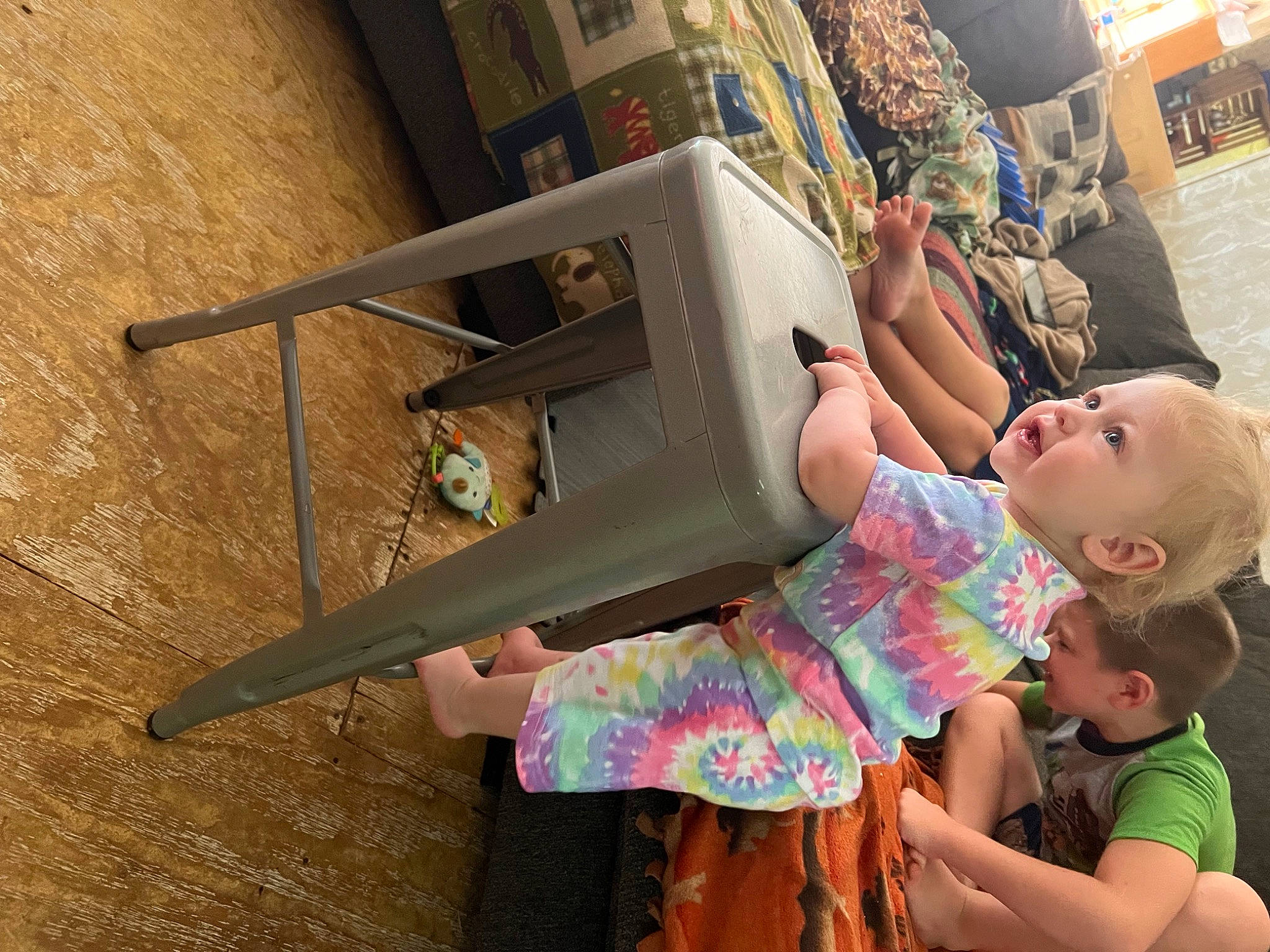 Kingsley is registered to the contest to win money with this photo: baby, child, eyewear, fun, happy, hat, leisure, magenta, person, play, room, sandal, sitting, sunglasses, t_shirt, toddler, travel, vacation, visual_arts, wood