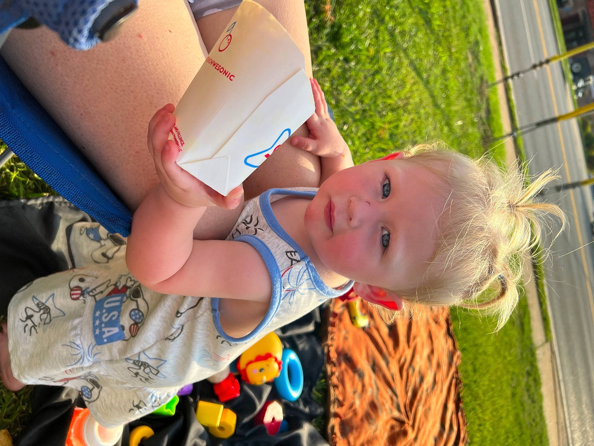 Kingsley is registered to the contest to win money with this photo: baby, baby_products, baby_toddler_clothing, child, event, fun, grass, happy, hat, leaf, leisure, people_in_nature, person, plant, play, recreation, smile, t_shirt, toddler, tree