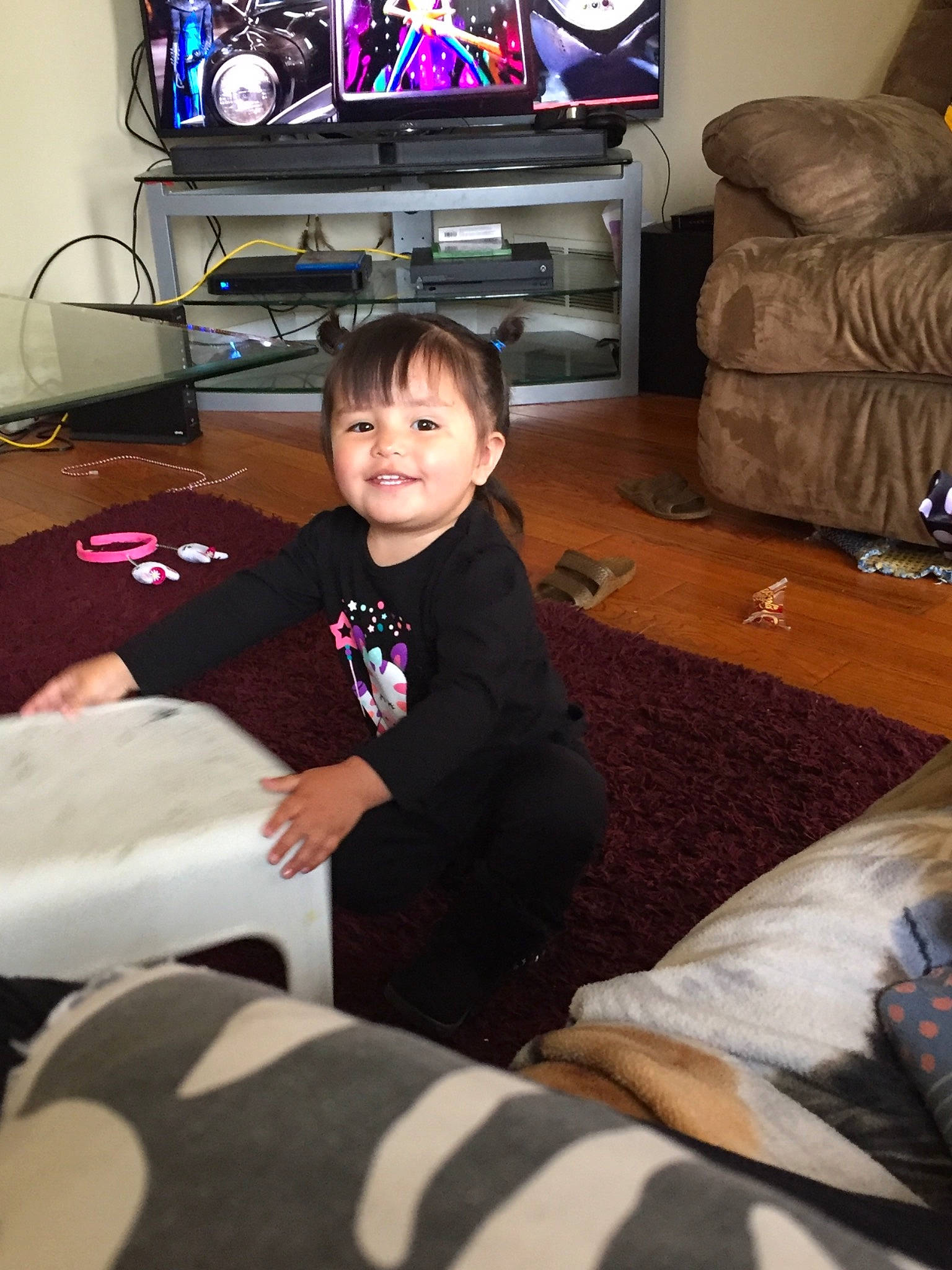 Lilo is registered to the contest to win money with this photo: child, electronic_device, electronics, furniture, gadget, joy, lap, living_room, media, person, play, room, sitting, technology, television, television_set, toddler