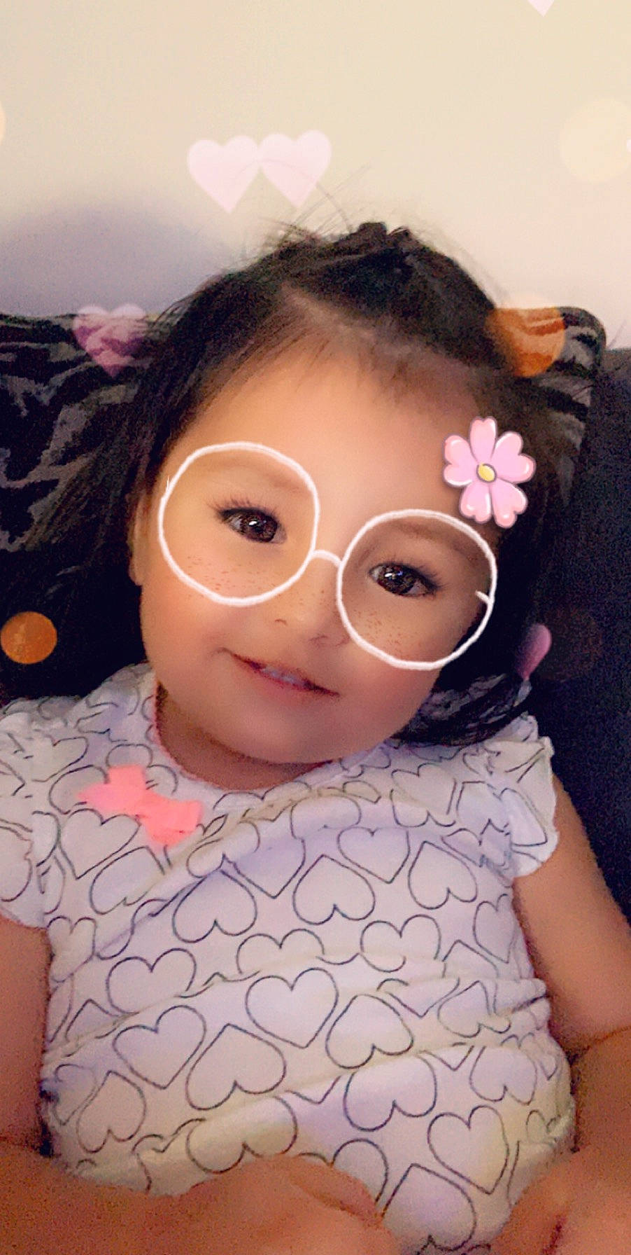 Lilo is registered to the contest to win money with this photo: black_hair, brown_hair, cheek, child, ear, eyebrow, eyewear, face, forehead, glasses, head, lip, nose, person, pink, skin, toddler, vision_care