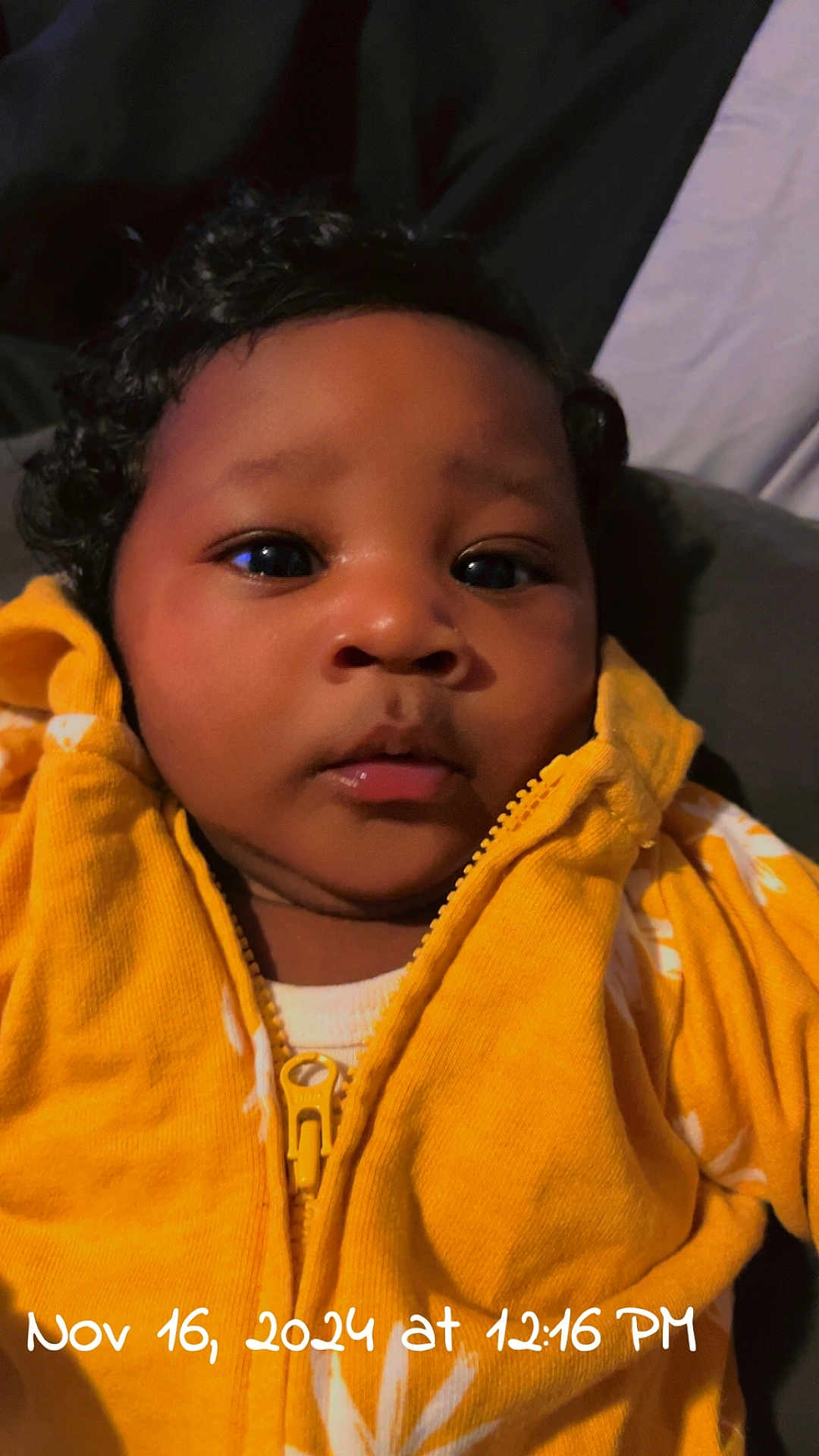 Daliah is registered to the contest to win money with this photo: baby, bodypart, clothing, coat, face, finger, fleece, hand, hat, head, hood, hoodie, jacket, knitwear, mouth, person, photography, portrait, sweater, sweatshirt