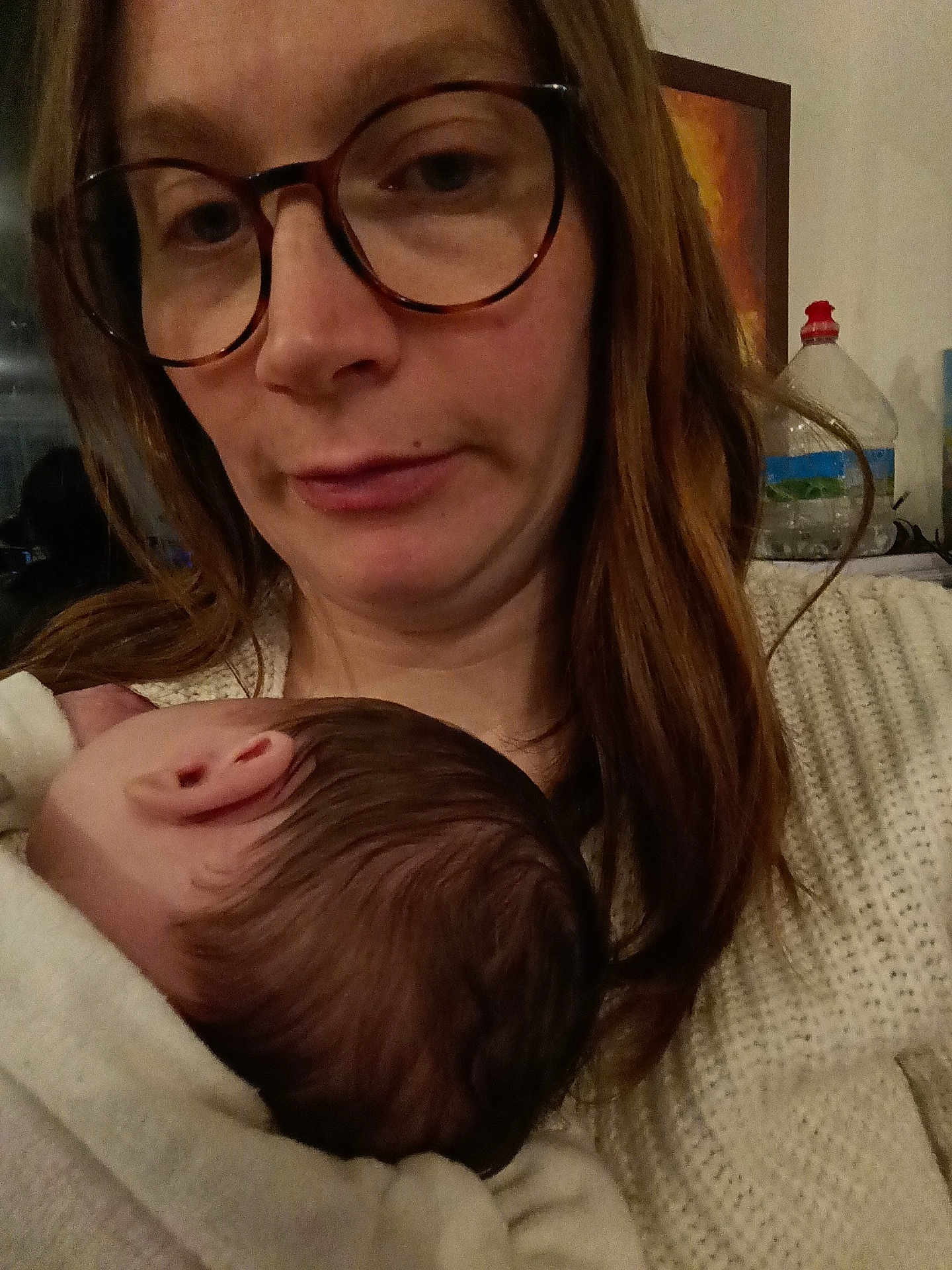 Irys participe au concours pour gagner de l'argent avec cette photo : woman, baby, glasses, indoor, closeup, head, hair, sweater, holding, sleeping, person, portrait, face, cozy, skin, comfort, parent, child, warm, intimate