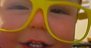 Samuel joined the competition — help win amazing prizes! blurry, cheeks, child, close_up, cute, eyewear, face, glasses, hair, happy, indoor, mischief, person, playful, portrait, shirt, smile, teeth, toddler, yellow_glasses