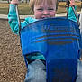 Samuel joined the competition — help win amazing prizes! blue_swing, bucket_swing, candid, child, daytime, face, grass, hands, jeans, metal_chains, outdoor, park, play, playground, smiling, swing, toddler, trees, turquoise_jacket, wood_chips