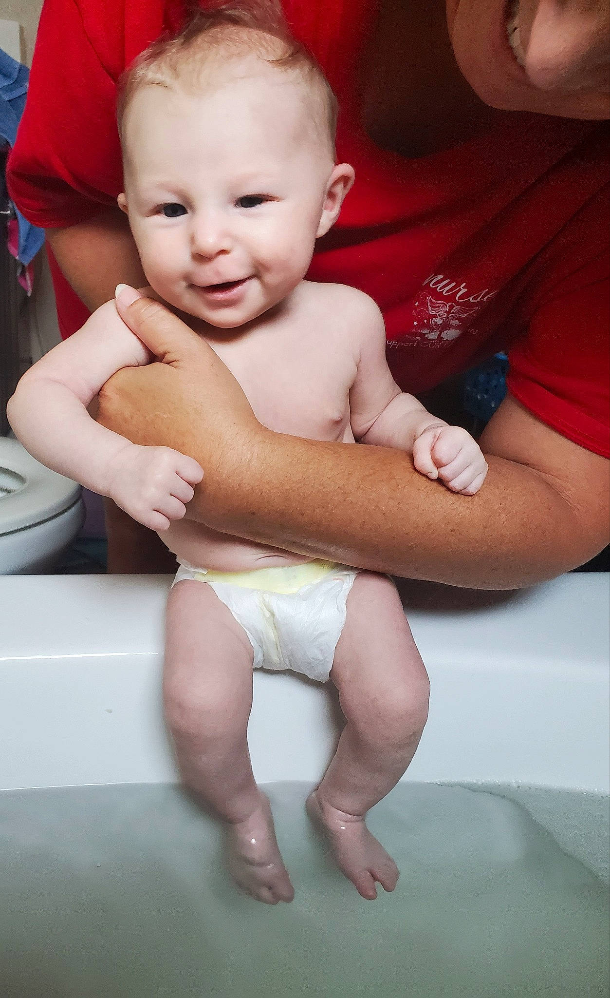 Annaliese is registered to the contest to win money with this photo: baby, bathing, cheek, child, diaper, hand, person, sitting, skin, smile, toddler