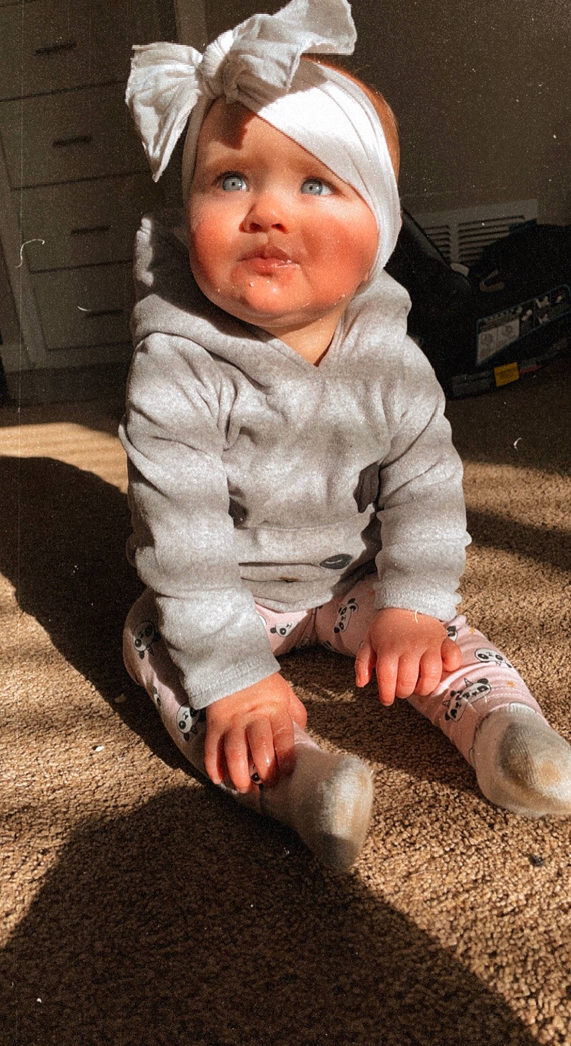 Madison is registered to the contest to win money with this photo: baby, baby_toddler_clothing, child, cool, eye, face, flooring, grass, happy, head, headwear, human_body, jacket, leg, lip, person, skin, sleeve, smile, toddler