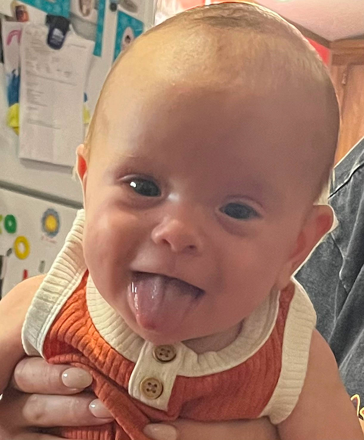 Trevor is registered to the contest to win money with this photo: baby, baby_toddler_clothing, cheek, child, ear, eyelash, finger, gesture, happy, iris, jaw, lip, mouth, nose, organ, person, skin, smile, thumb, toddler