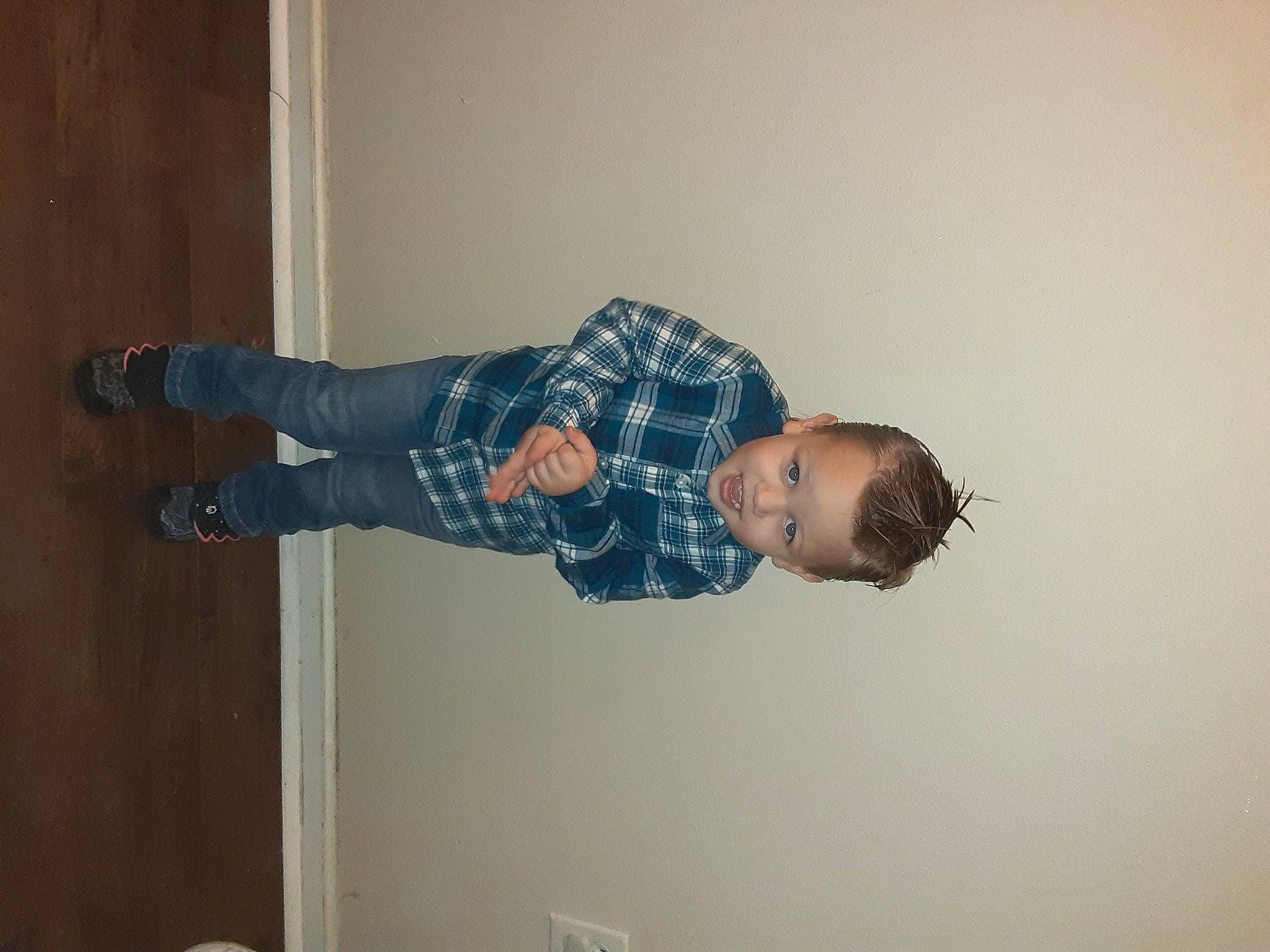 Kace is registered to the contest to win money with this photo: ceiling, child, elbow, electric_blue, flooring, fun, hardwood, knee, outdoor_shoe, person, plaster, room, sleeve, t_shirt, toddler, walking_shoe, wood, wrist