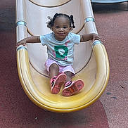 Layla Salley joined the competition — help win amazing prizes! child, toddler, slide, playground, smiling, outdoor, pigtails, pink_shoes, shorts, tshirt, play, fun, leisure, happy, recreation, park, activity, person, casual_clothing, daytime