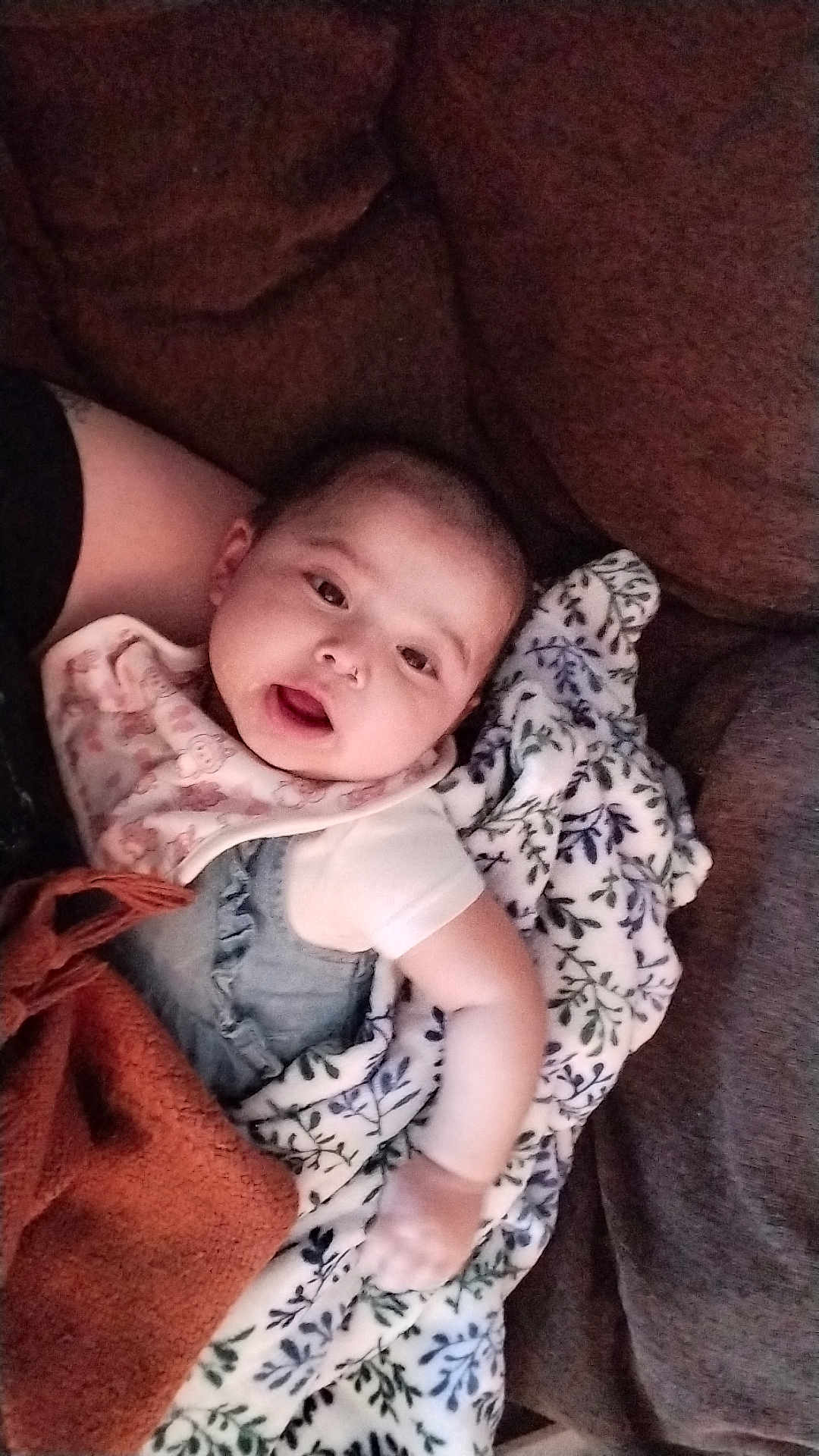 Zailee is registered to the contest to win money with this photo: baby, blanket, couch, infant, person, face, clothing, expression, home, comfort, fabric, soft, cute, indoor, relaxing, child, pattern, warm, skin, portrait