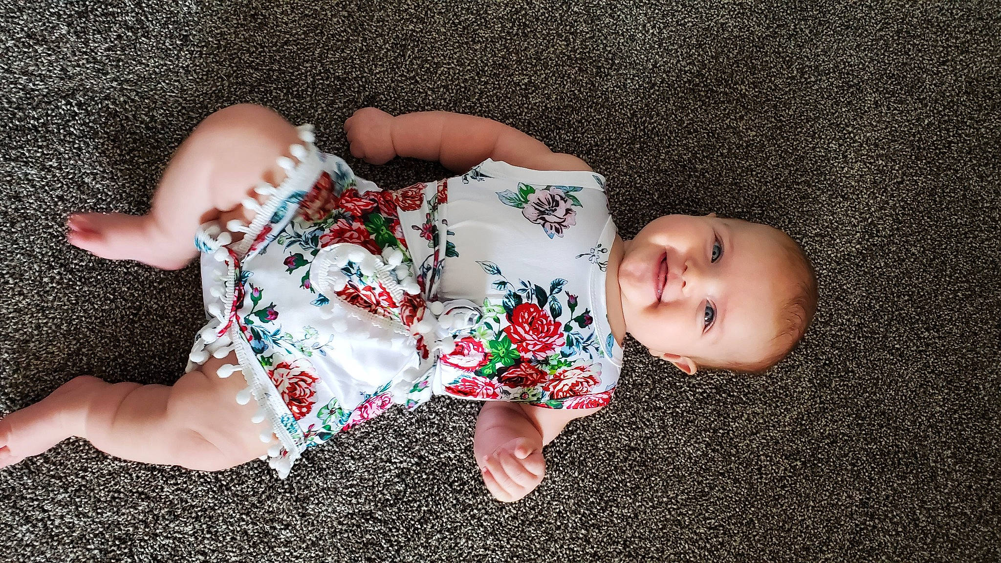 Remington is registered to the contest to win money with this photo: baby, baby_toddler_clothing, child, dress, finger, flooring, grass, green, hand, joy, leg, pattern, person, photography, plant, play, skin, sleep, toddler