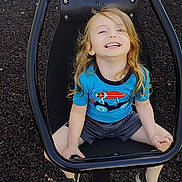 Adam Jr. joined the competition — help win amazing prizes! child, swing, playground, smiling, happy, outdoor, toy, blue_shirt, shorts, shoes, blonde_hair, laughing, seat, black_frame, mulch, wall, daylight, person, casual_clothing, fun