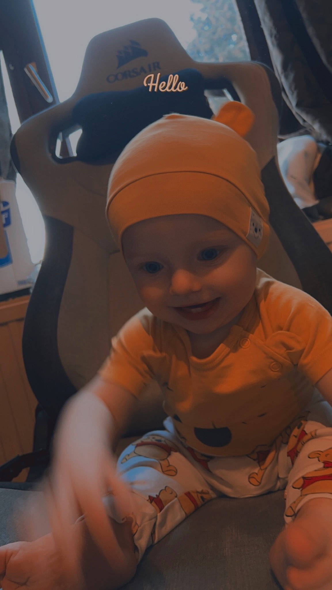Loukas participe au concours pour gagner de l'argent avec cette photo : baby, baby_toddler_clothing, baseball_cap, beanie, cap, child, family_car, flooring, fun, happy, hat, headwear, joy, person, personal_protective_equipment, recreation, room, sitting, smile, t_shirt