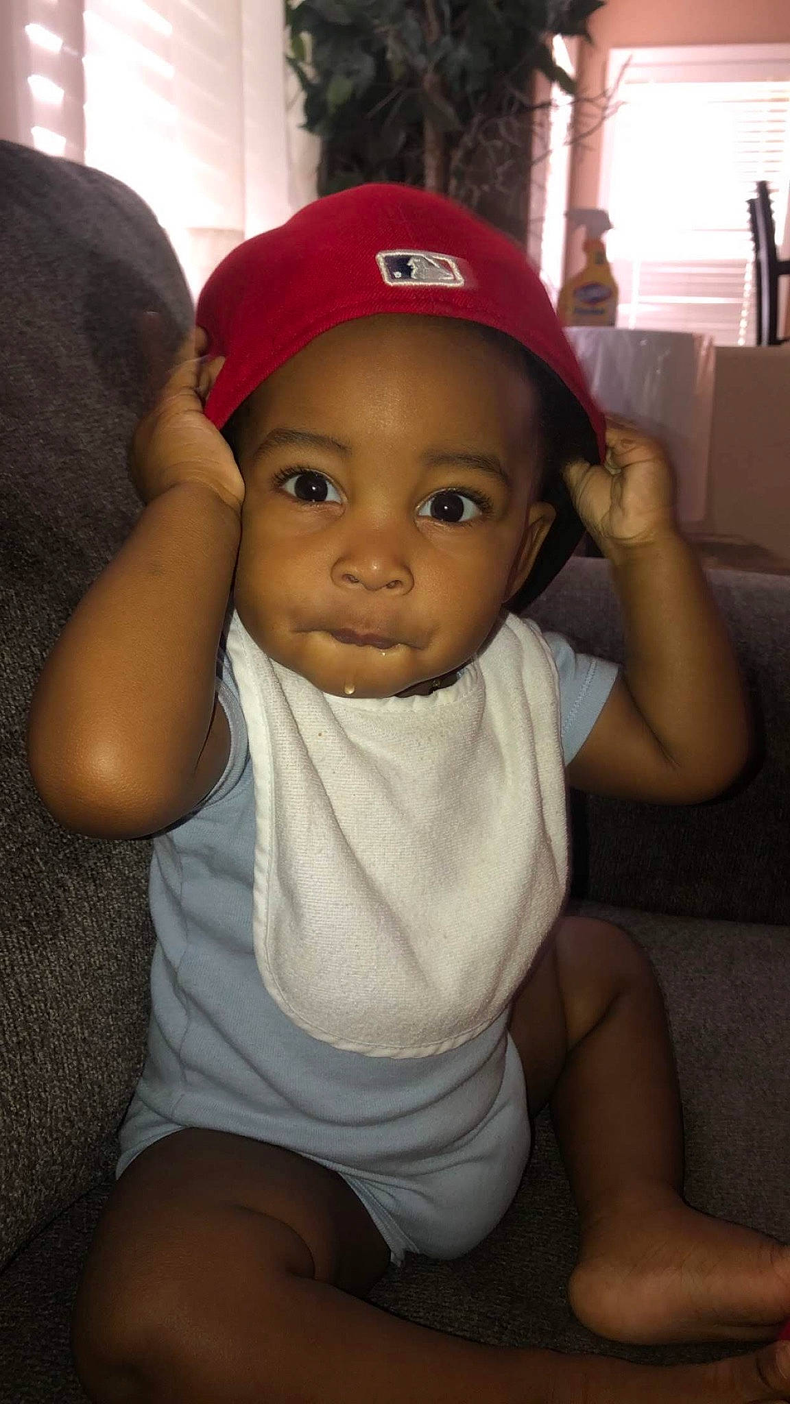 Damari is registered to the contest to win money with this photo: baby, cap, cheek, child, head, headgear, headwear, person, skin, toddler