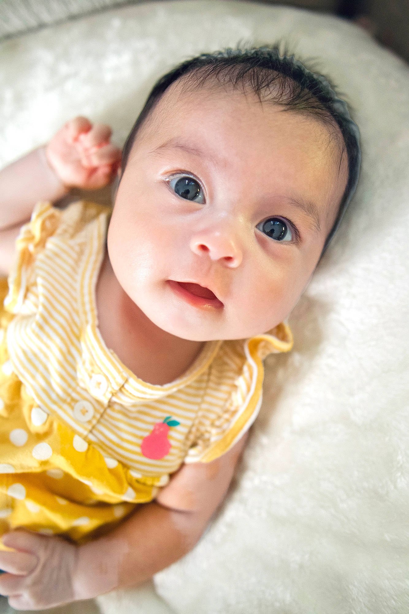 Amoura is registered to the contest to win money with this photo: baby, baby_toddler_clothing, cheek, child, chin, collar, dress, eye, facial_expression, flash_photography, happy, iris, lip, mouth, nose, person, product, skin, sleeve, textile