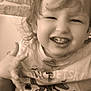 casual, child, clothing, cute, dinosaur_shirt, expression, face, hair, hand, happy, high_chair, indoor, messy, playful, portrait, sepia, smiling, teeth, toddler, young_child