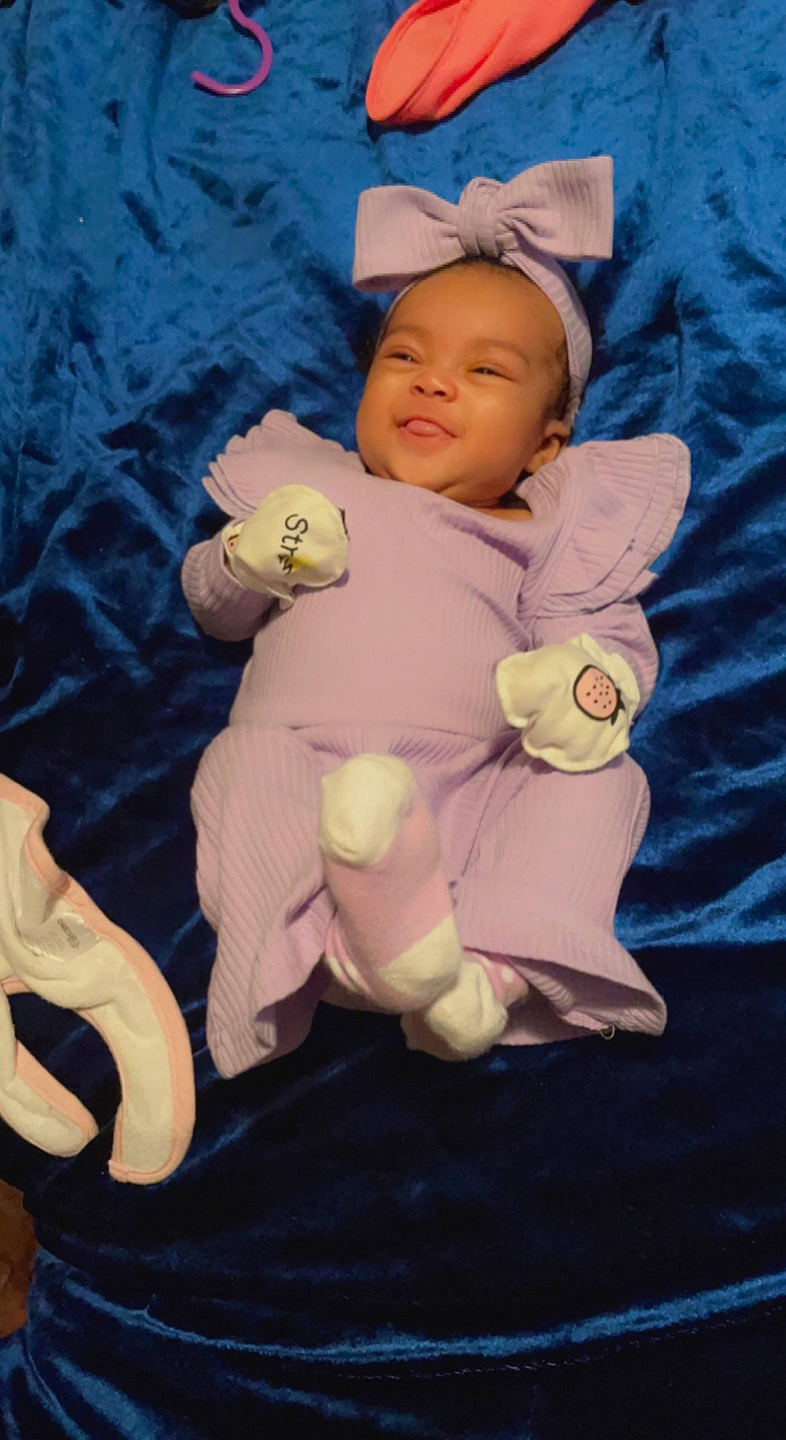 Journi is registered to the contest to win money with this photo: baby, baby_products, baby_sleeping, baby_toddler_clothing, cap, cheek, child, comfort, gesture, hand, happy, linens, person, plush, purple, sitting, smile, stuffed_toy, teddy_bear, toddler
