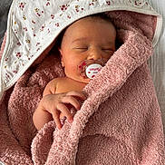 Lyana participe au concours pour gagner de l'argent avec cette photo : baby, blanket, child, closeup, cozy, cute, face, hand, indoors, infant, newborn, pacifier, peaceful, pink, resting, skin, sleeping, soft, towel, wrapped