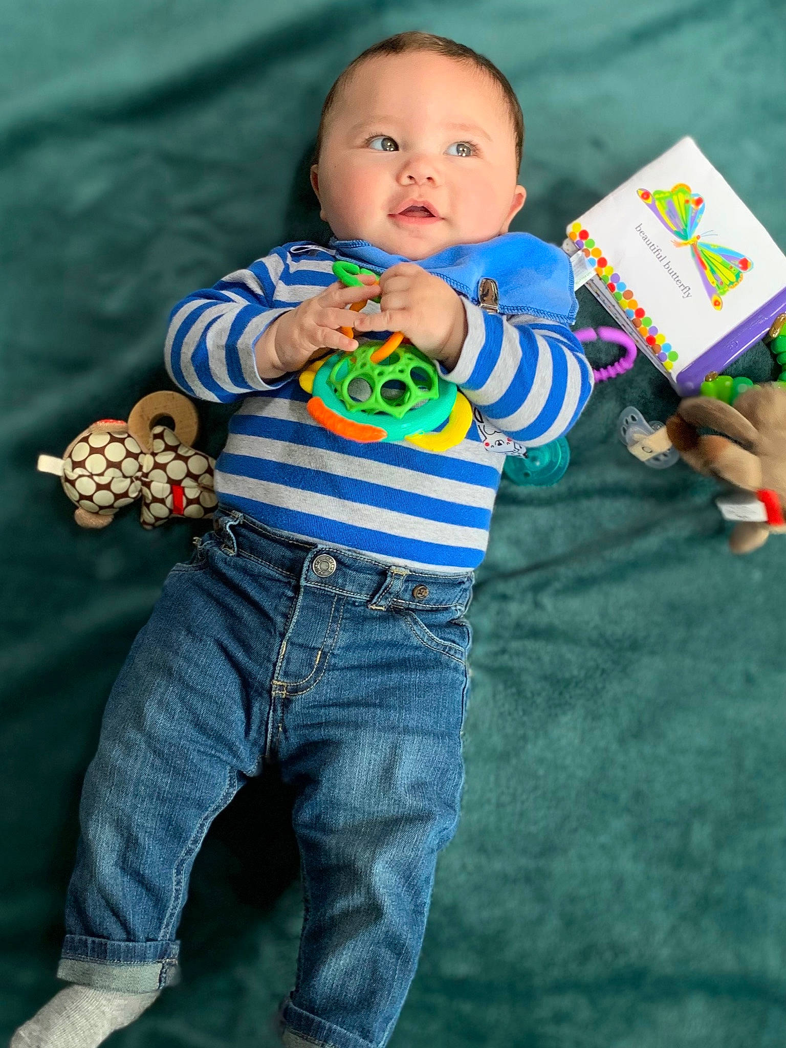 Westley is registered to the contest to win money with this photo: baby, baby_products, baby_toddler_clothing, baby_toys, child, denim, eye, fun, grass, green, happy, head, linens, pattern, person, play, sitting, sleeve, t_shirt, toddler