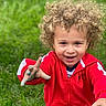 Tydus joined the competition — help win amazing prizes! child, toddler, curly_hair, red_jacket, outdoor, grass, smiling, happy, face, person, playful, young_child, cute, portrait, casual_clothing, expression, fun, nature, greenery, gesture