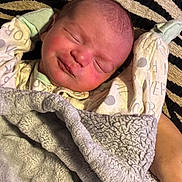 Wyatt joined the competition — help win amazing prizes! newborn, baby, sleeping, infant, face, portrait, blanket, swaddle, mittens, clothing, striped_blanket, cozy, indoors, close_up, peaceful, resting, head, soft_texture, photography, child
