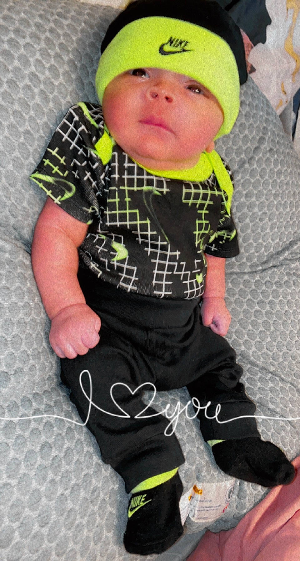 Kaleb joined the competition — help win amazing prizes! baby, baby_toddler_clothing, blue, cap, cheek, cool, green, headwear, knee, pattern, person, personal_protective_equipment, pink, plaid, skin, sleeve, sock, t_shirt, tartan, textile