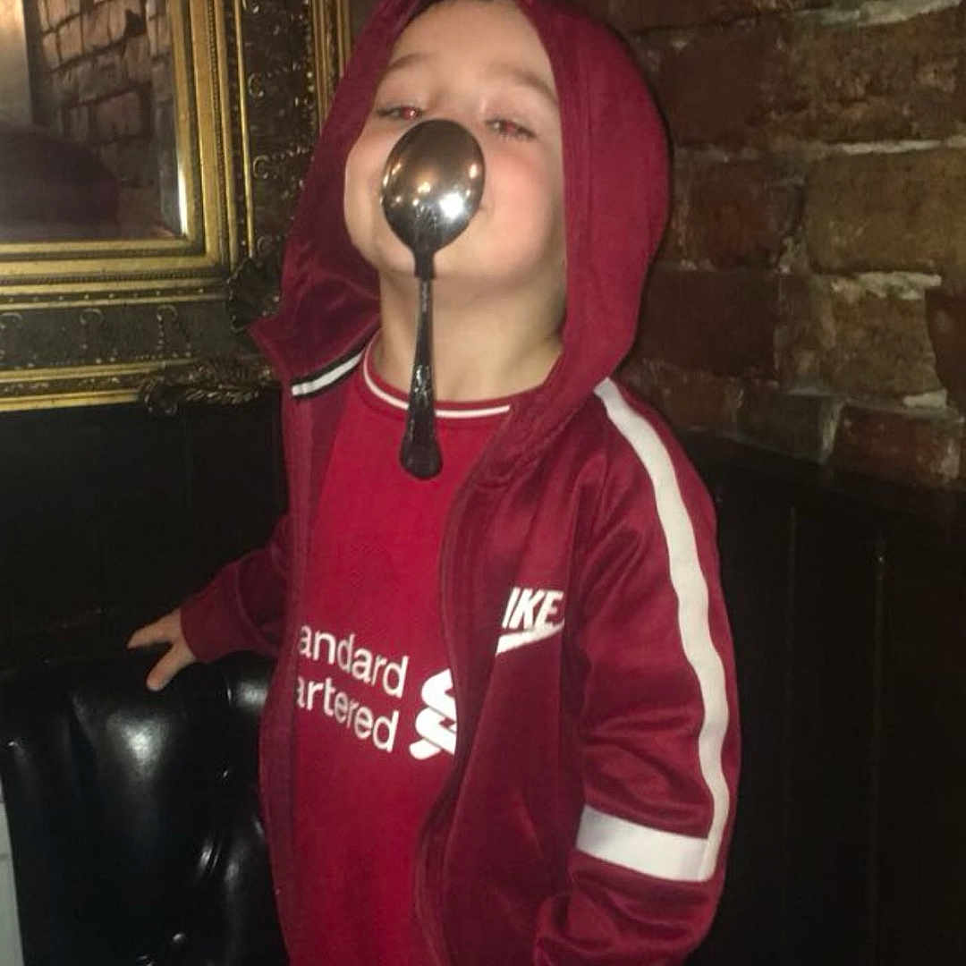 Bobby is registered to the contest to win money with this photo: cap, clothing, coat, cutlery, face, head, hood, hoodie, jacket, kitchenutensil, knitwear, ladle, maroon, person, photography, portrait, spoon, sweater, sweatshirt, t_shirt