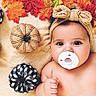 baby, infant, child, portrait, pacifier, headband, bow, autumn, fall, leaves, pumpkins, fabric_pumpkins, blanket, lying_down, close_up, wide_eyes, indoor, seasonal, cozy, photography