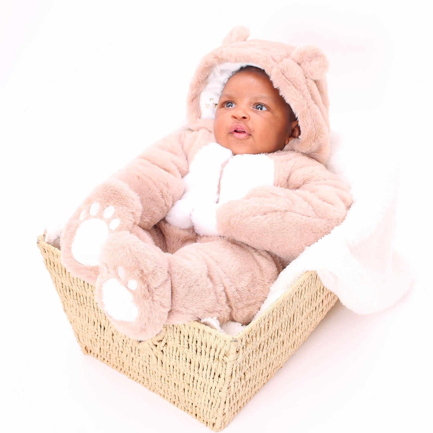 Ahkari joined the competition — help win amazing prizes! baby, infant, child, basket, onesie, bear_costume, fluffy, cute, portrait, soft, blanket, white_background, cozy, pout, wide_eyes, seated, adorable, warm, indoor, newborn