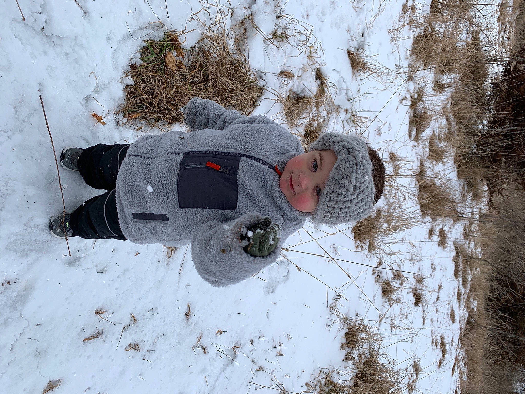 Mason joined the competition — help win amazing prizes! car, freezing, frost, fun, geological_phenomenon, grass, hat, headwear, human_body, jacket, person, plant, playing_in_the_snow, recreation, slope, snapshot, snow, tree, twig, window