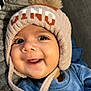 baby, beanie, bodypart, bonnet, cap, clothing, coat, face, finger, hand, happy, hat, head, hood, jacket, person, photography, portrait, scarf, smile