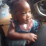 Genesis joined the competition — help win amazing prizes! toddler, child, girl, face, indoor, pink_bow, denim_dress, curious, furniture, chair, earrings, portrait, young_child, person, skin, hand, hair, looking, casual, home