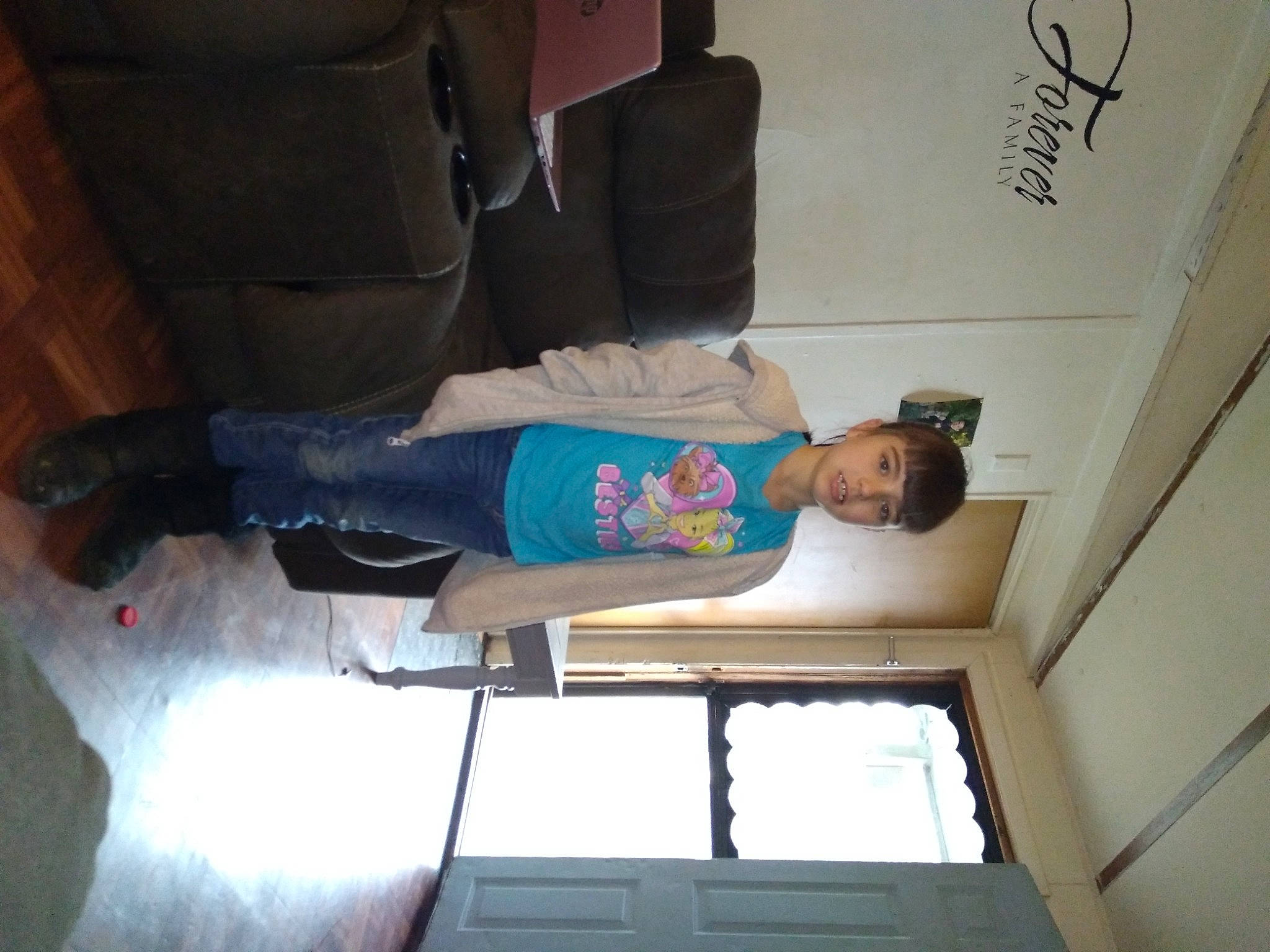 Aubrey joined the competition — help win amazing prizes! ceiling, comfort, elbow, flooring, fun, hardwood, human_leg, jeans, knee, person, room, t_shirt, thigh, walking_shoe, wood, wrist