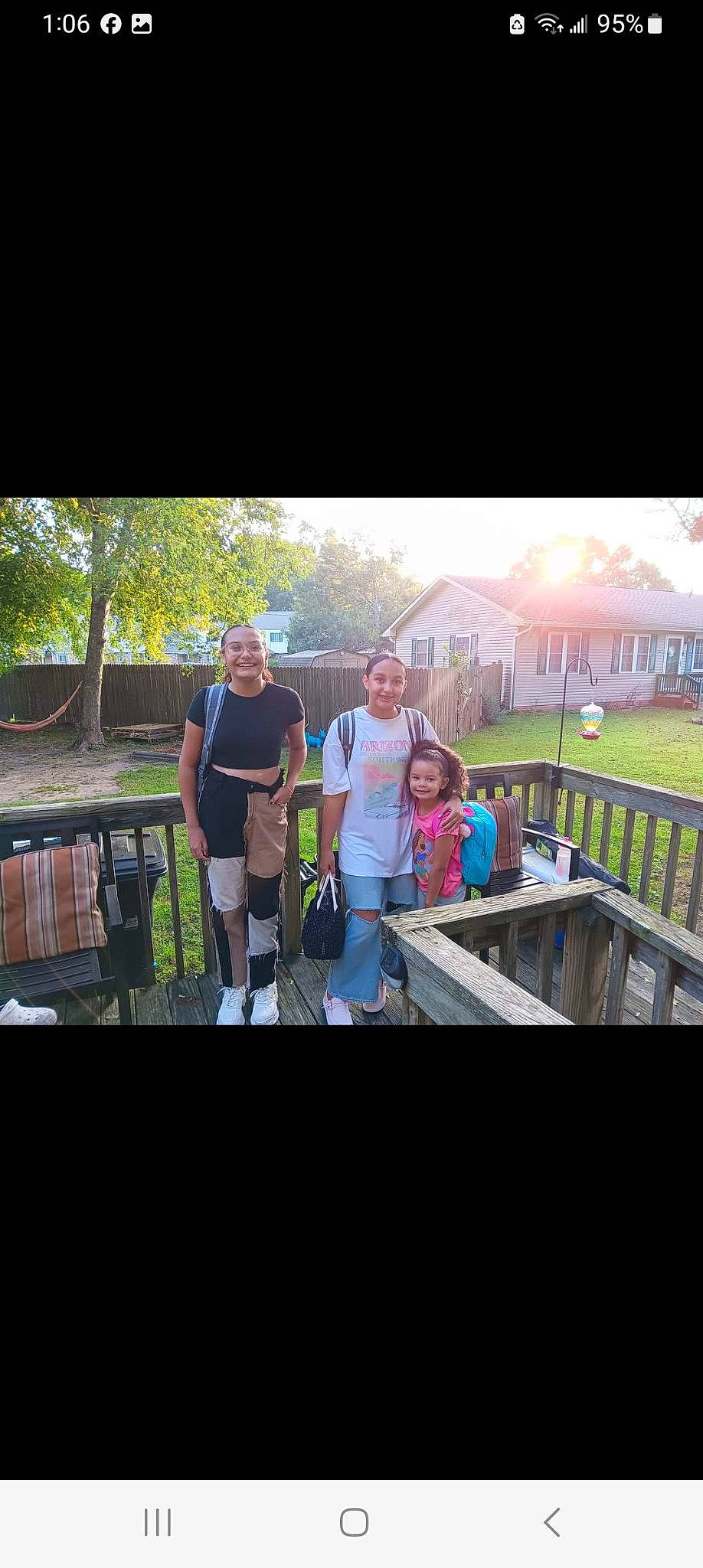 Desiree is registered to the contest to win money with this photo: bridge, child, event, eyewear, fence, fun, grass, happy, headwear, joy, landscape, leisure, metal, person, plant, recreation, shorts, sitting, smile, soil