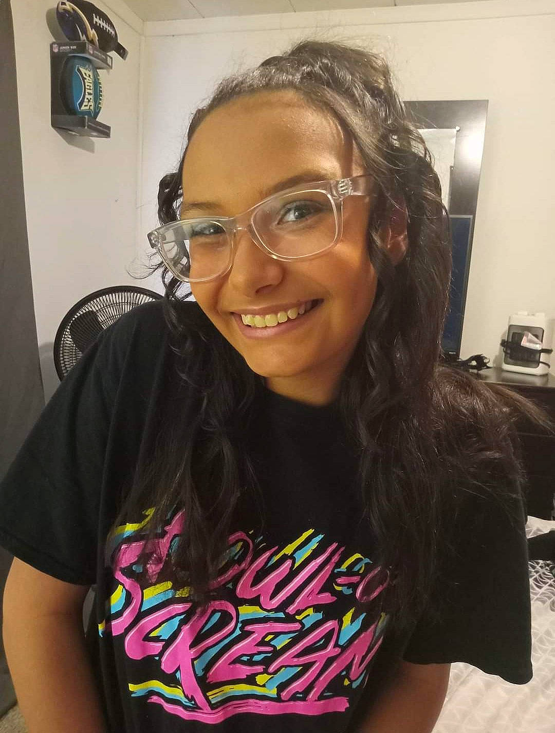 Desiree joined the competition — help win amazing prizes! arm, beauty, black_hair, chest, cool, event, eyewear, fashion_design, forehead, fun, glasses, happy, joy, pattern, person, picture_frame, shoulder, sleeve, smile, t_shirt