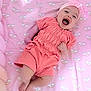 baby, infant, smiling, laughing, pink, blanket, rainbow, cloud, headband, clothing, cute, happy, lying_down, child, soft_texture, indoors, playful, cheerful, adorable, infant_girl