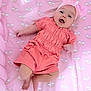 baby, infant, pink_outfit, headband, bow, blanket, rainbow_pattern, cloud_pattern, smiling, happy, cute, child, lying_down, soft_texture, indoors, portrait, toddler, skin, clothing, person