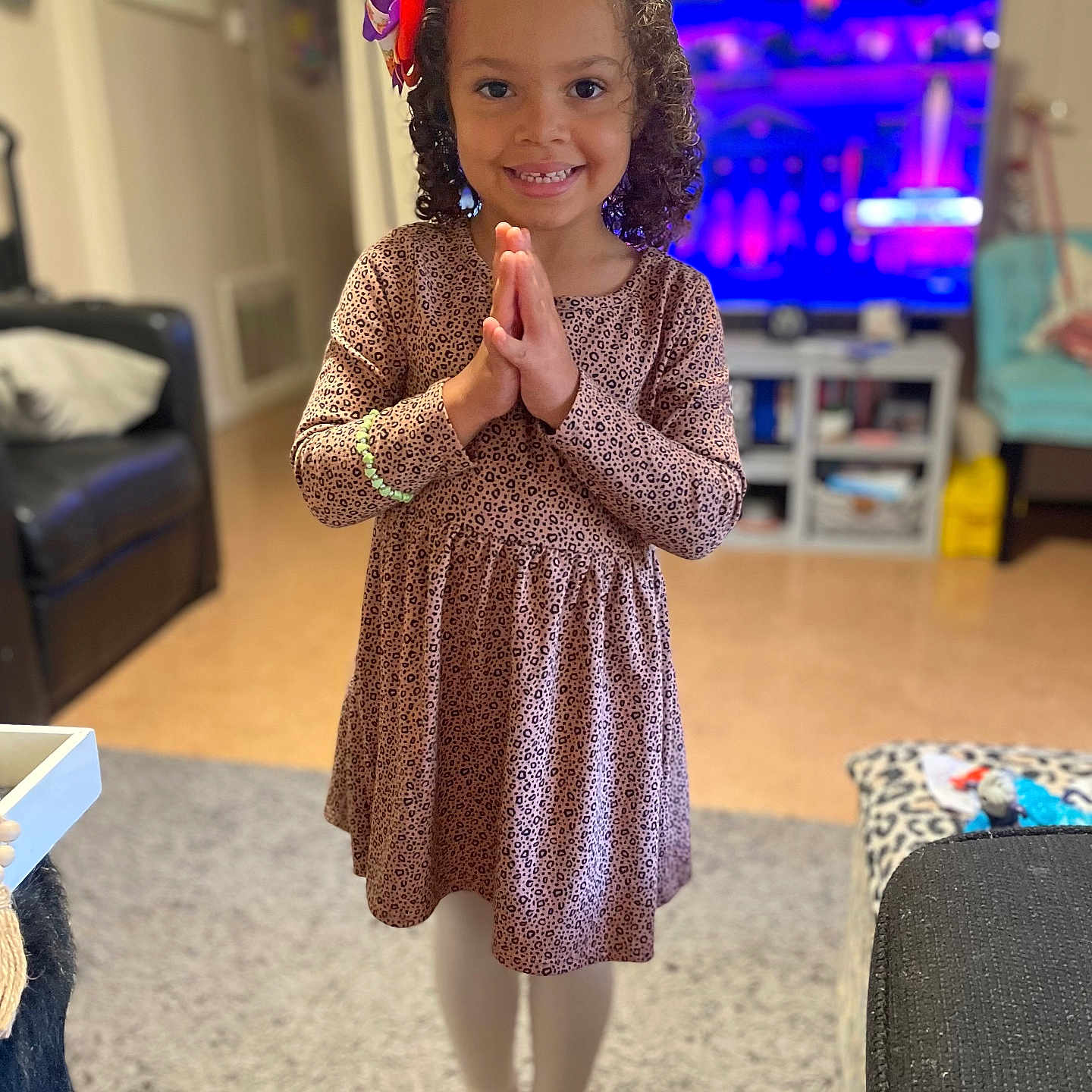 Aniyah is registered to the contest to win money with this photo: animal, canine, child, clothing, couch, curlyhair, dog, dress, female, footwear, furniture, girl, hair, head, knitwear, person, pet, shoe, sleeve, sweater