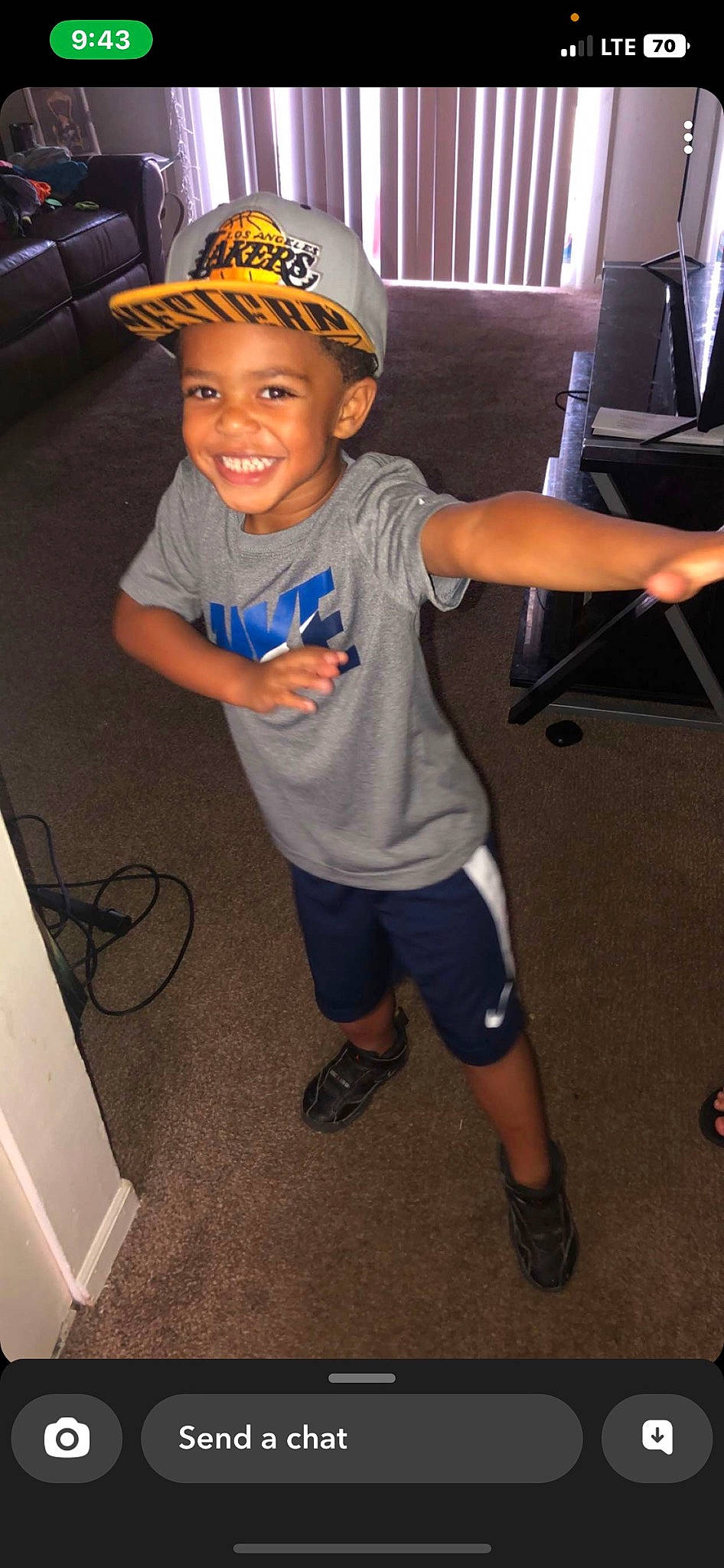 King is registered to the contest to win money with this photo: arm, baseball_cap, bicycle_helmet, cap, child, cool, electric_blue, flash_photography, fun, hat, headwear, joy, leg, person, personal_protective_equipment, recreation, shoe, shorts, smile, sneakers