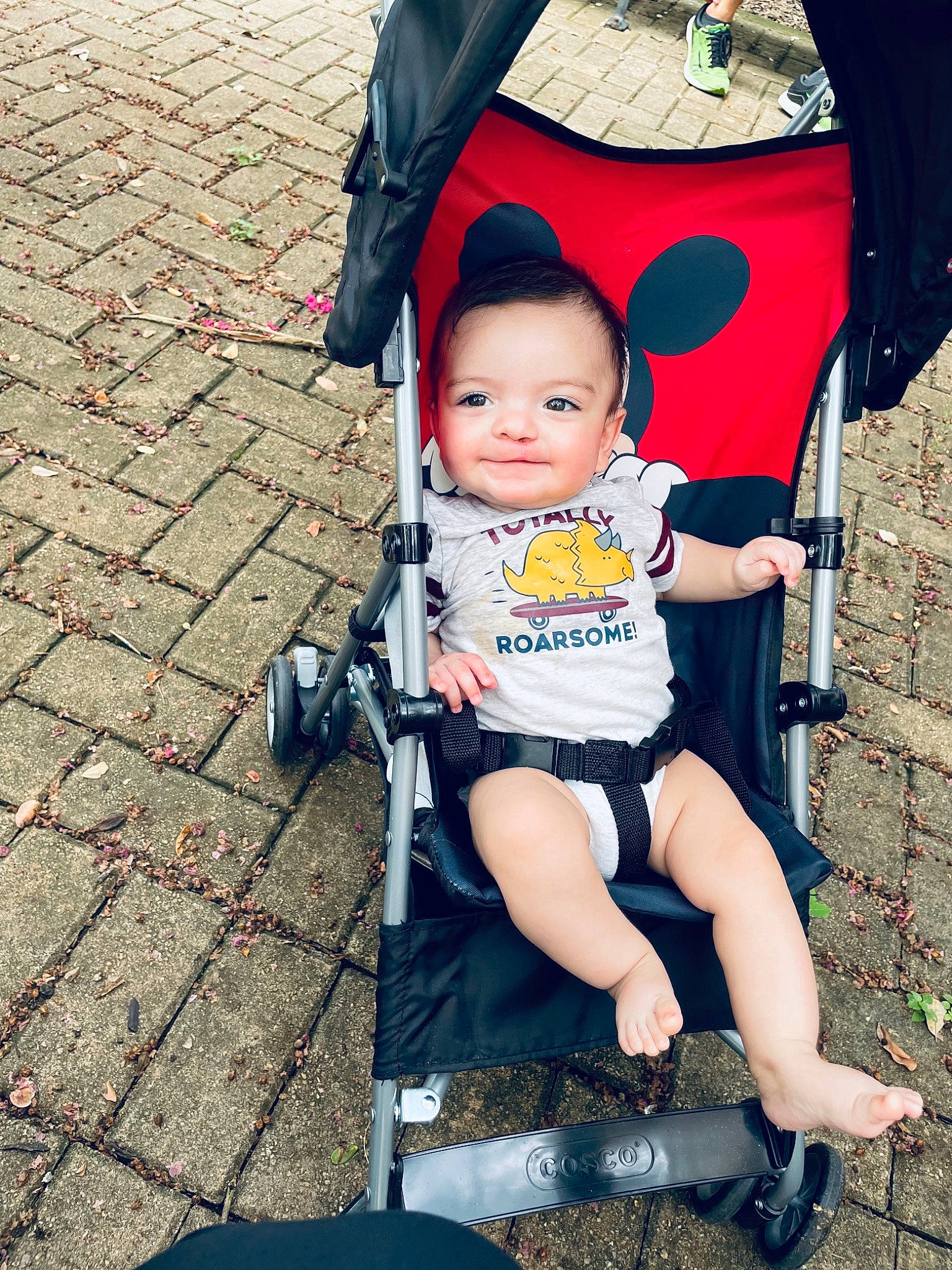 Gideon is registered to the contest to win money with this photo: baby, baby_carriage, baby_products, baby_toddler_clothing, child, fashion_accessory, fun, happy, human_leg, joy, lap, leg, leisure, person, product, recreation, shoe, sitting, thigh, toddler