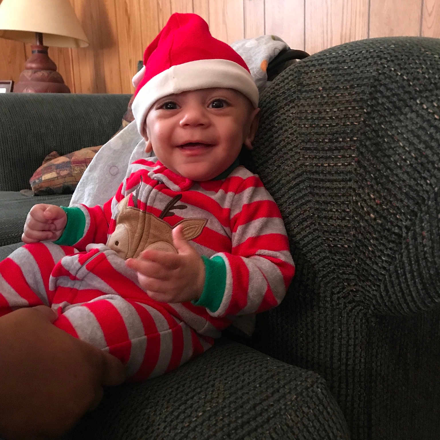 Brady is registered to the contest to win money with this photo: cap, child, christmas, cool, day, fun, hat, headgear, headwear, holiday, infant, lap, person, product, red, sitting, skin, smile, textile, toddler