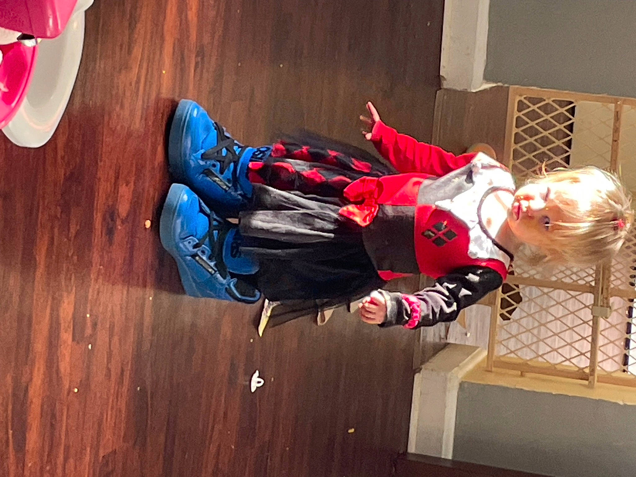 Ava is registered to the contest to win money with this photo: adventure, carmine, child, comfort, electric_blue, flooring, fun, hardwood, leisure, luggage_and_bags, outdoor_shoe, person, recreation, red, room, sneakers, sportswear, toddler, walking_shoe, wood