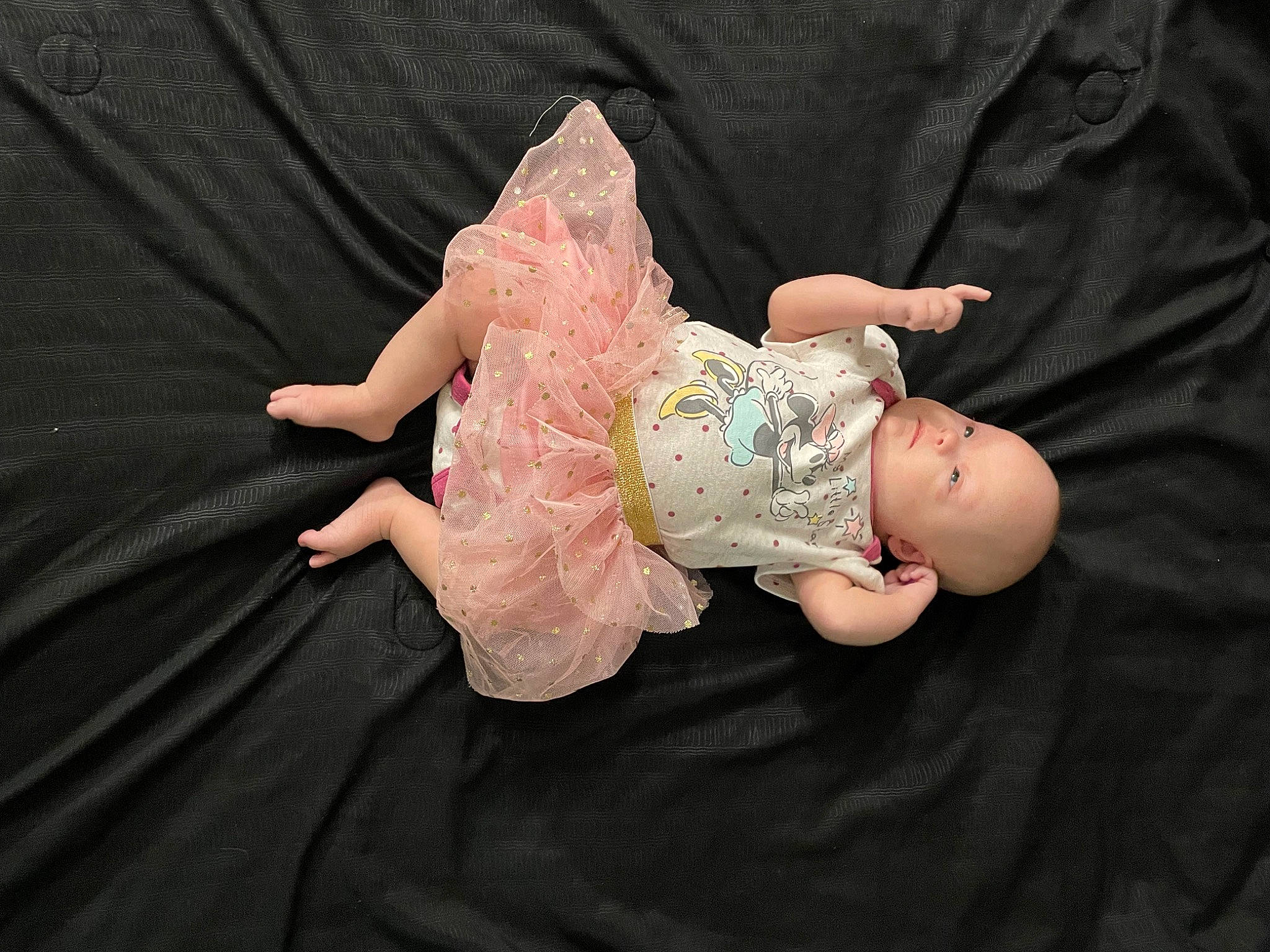 Luna is registered to the contest to win money with this photo: baby, baby_toddler_clothing, child, doll, dress, embellishment, event, fashion_accessory, fun, gesture, happy, leg, mythical_creature, nail, peach, person, sitting, sweetness, thumb, toy