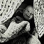 Waylen is registered to the contest to win money with this photo: baby, blanket, black_and_white, child, cute, fabric, face, happy, indoor, pattern, person, play_tent, smile, soft, teepee, texture, toy, young_child, wrapped, infant