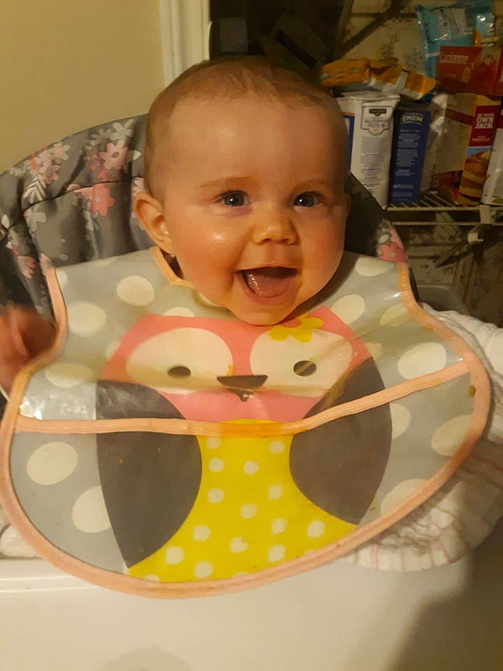 Abbigail is registered to the contest to win money with this photo: baby, baby_products, baby_safety, baby_toddler_clothing, bib, cheek, child, circle, comfort, eye, eyelash, fun, iris, pattern, person, polka_dot, shelf, shipping_box, sitting, smile