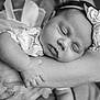 arm, baby, black_and_white, closeup, clothing, flower, hand, headband, human, infant, lace, newborn, peaceful, person, portrait, rest, skin, sleeping, soft, tenderness