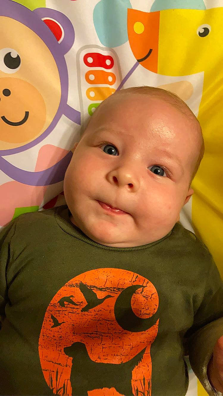 Harlan is registered to the contest to win money with this photo: art, baby, calabaza, cheek, child, chin, cool, facial_expression, forehead, fun, happy, human, mouth, nose, orange, organ, person, sleeve, smile, t_shirt