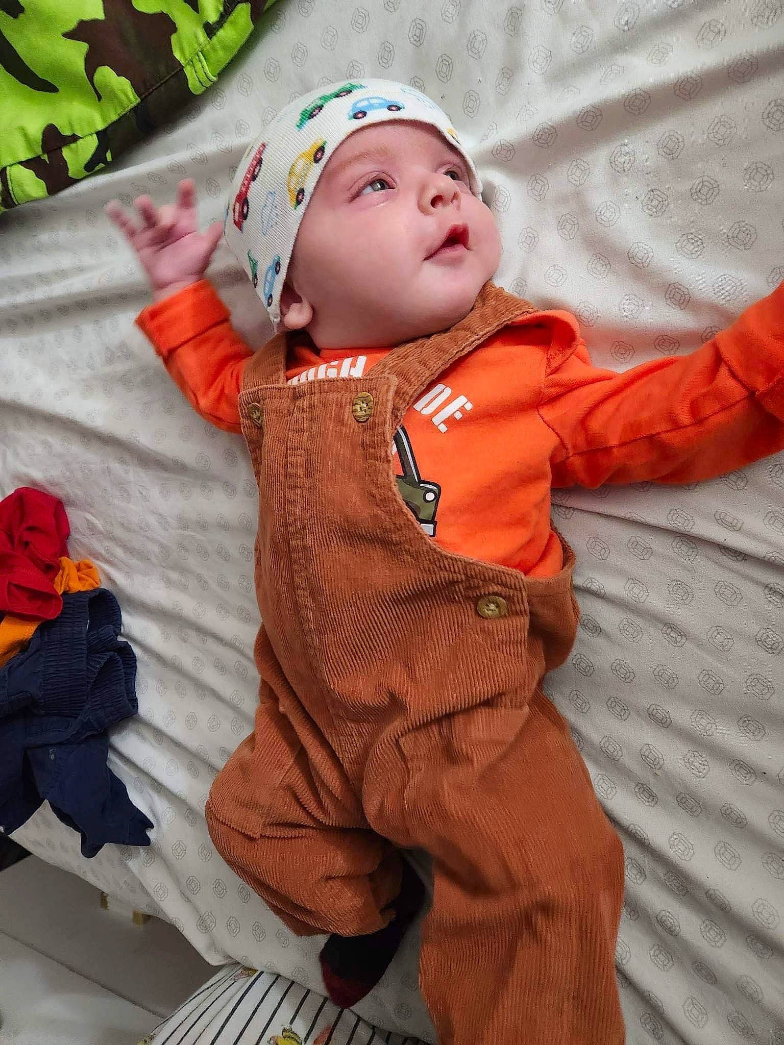 Donovan is registered to the contest to win money with this photo: baby, baby_products, baby_toddler_clothing, child, costume, fun, fur, grass, happy, headwear, orange, pattern, peach, person, personal_protective_equipment, pink, play, portrait_photography, sitting, sleeve