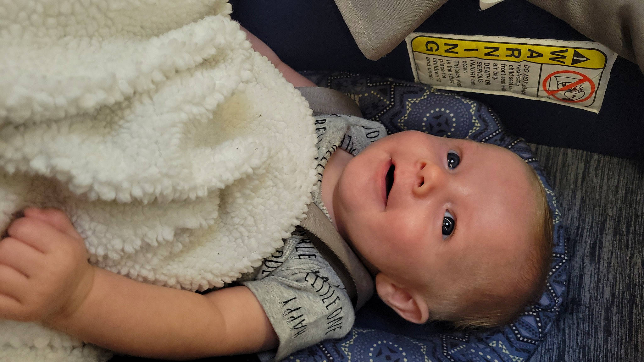 Logan joined the competition — help win amazing prizes! baby, baby_toddler_clothing, cheek, child, chin, close_up, comfort, eye, eyelash, finger, gesture, hand, headgear, human_body, lip, mouth, nose, person, skin, textile